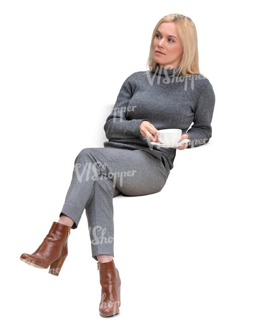 woman sitting and drinking coffee