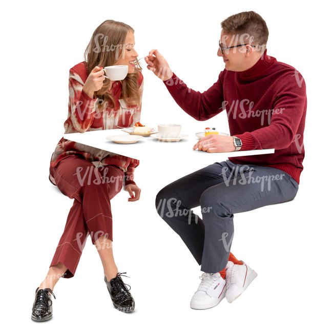 couple eating cake in a restaurant