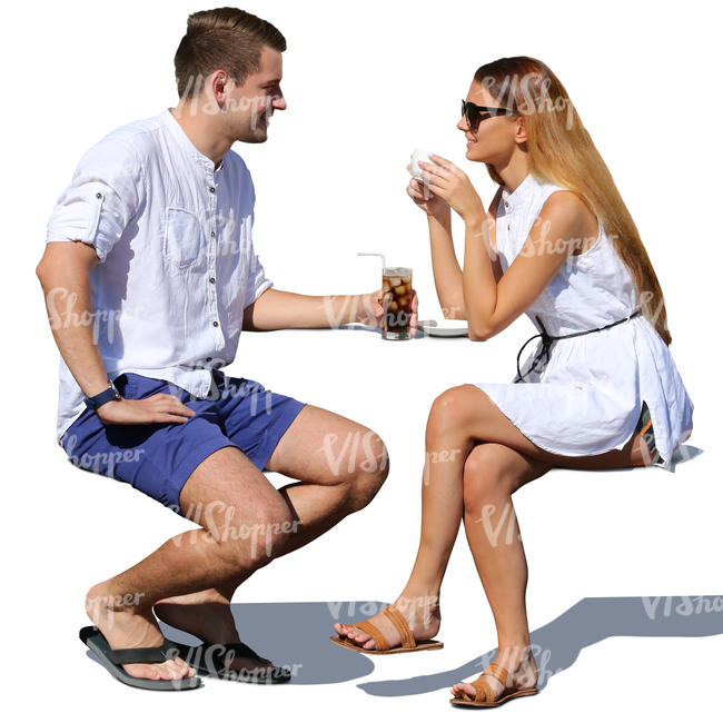 couple sitting and talking a street cafe in summertime