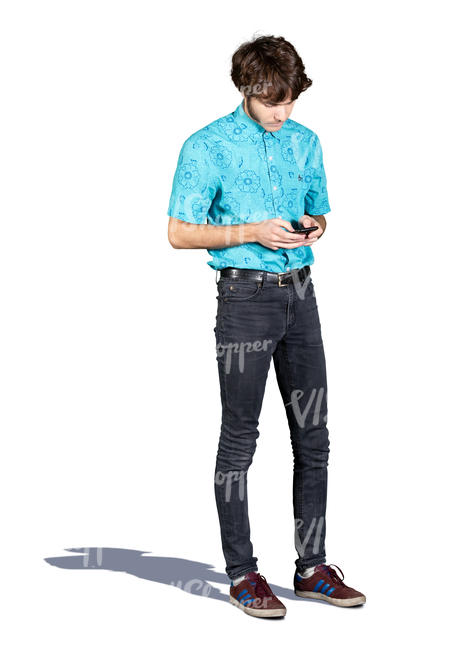 young man standing and checking his phone
