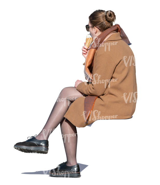 woman sitting and eating ice cream