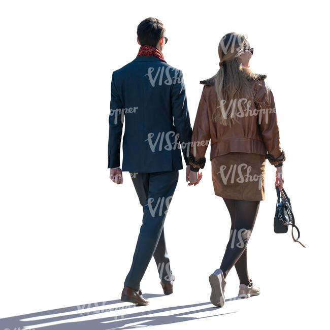 man and woman walking hand in hand on a spring day