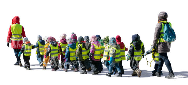 group of kindergarten children walking on the street