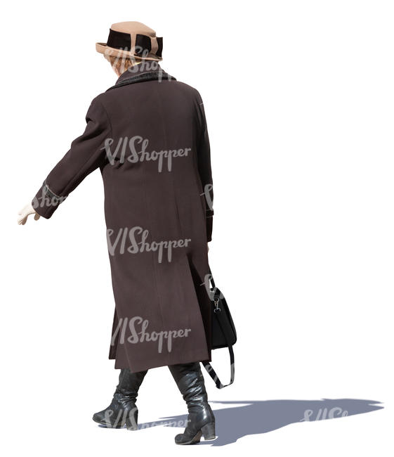 older woman in a brown overcoat walking