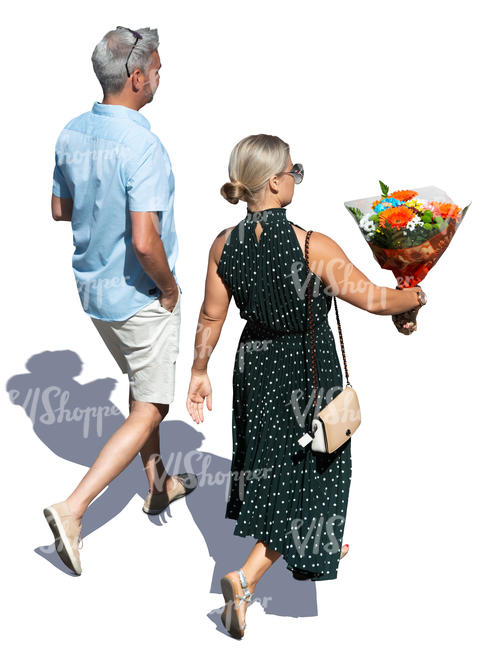 man and woman walking and carrying flowers seen from above