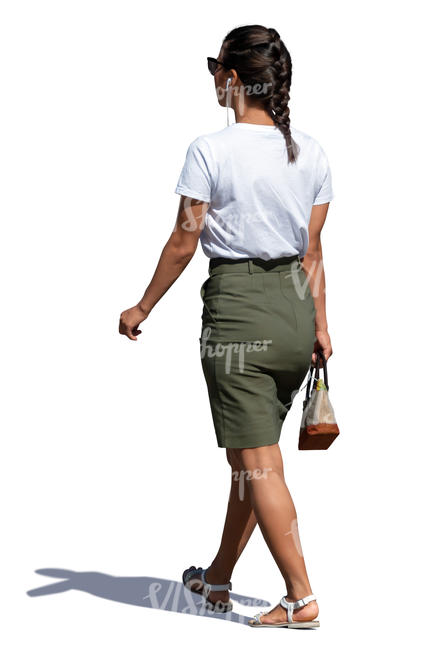 woman with earphones walking on a summer day