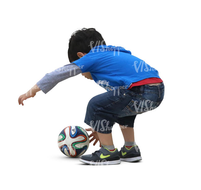 little boy playing with a ball