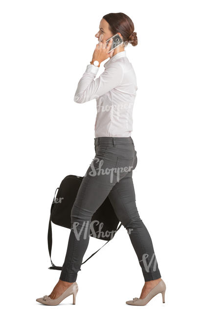 businesswoman walking and talking on a phone