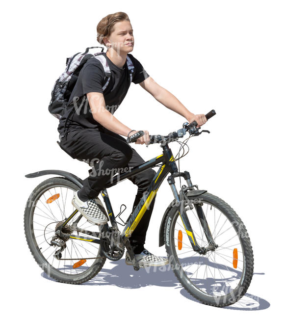 teenage boy riding a bike