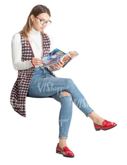 woman sitting and reading a magazine
