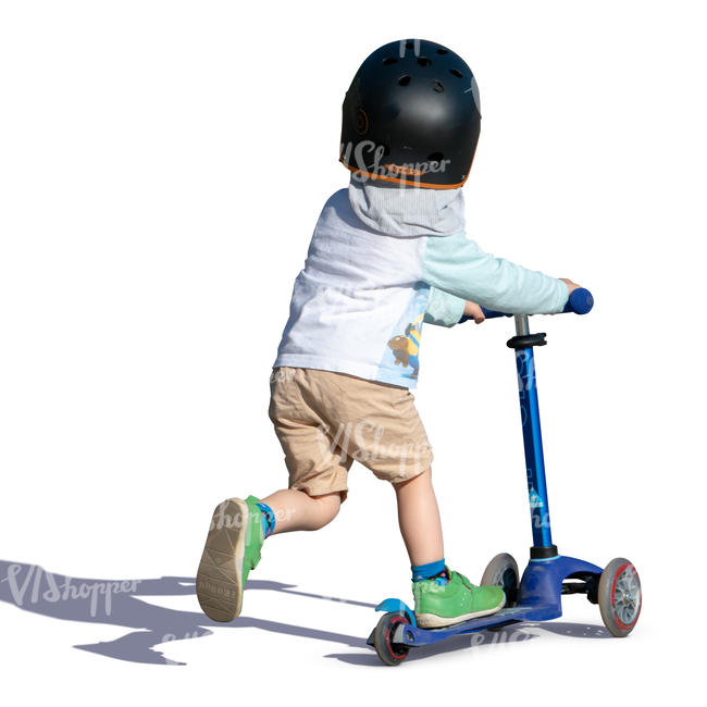 little boy riding a scooter