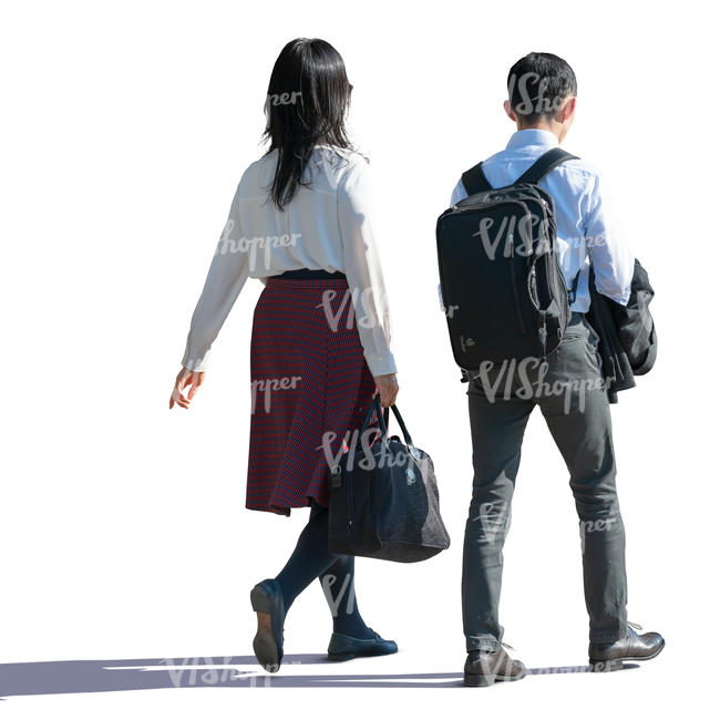 backlit asian man and woman walking