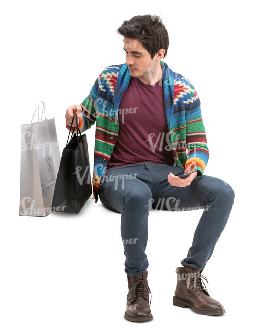 man with shopping bags sitting