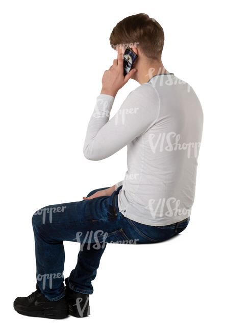 man sitting and talking on the phone