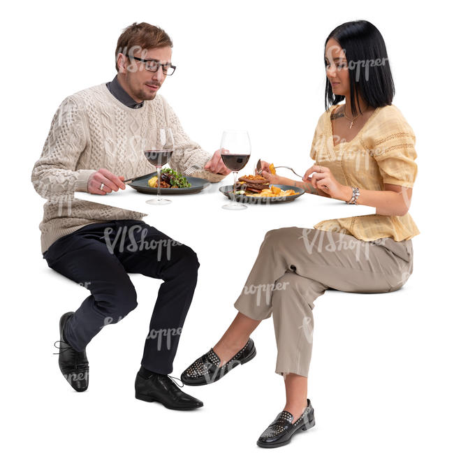 man and woman sitting in a restaurant