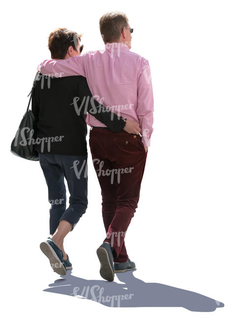 backlit older couple walking