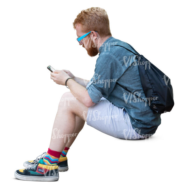 man sitting and texting