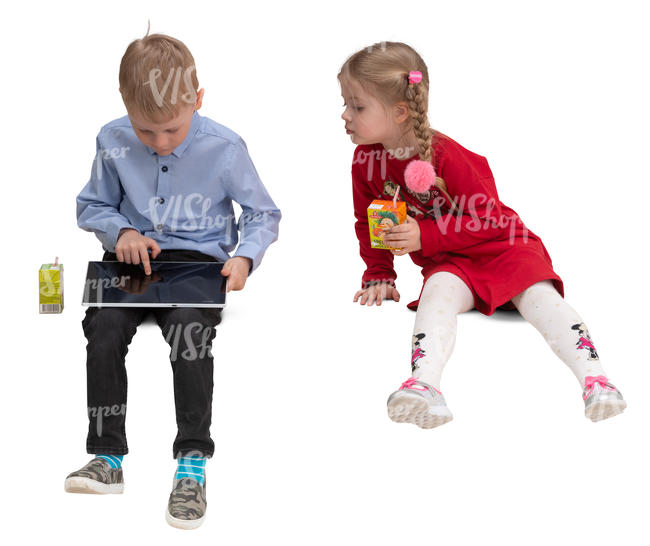 boy and girl sitting and looking at a tablet