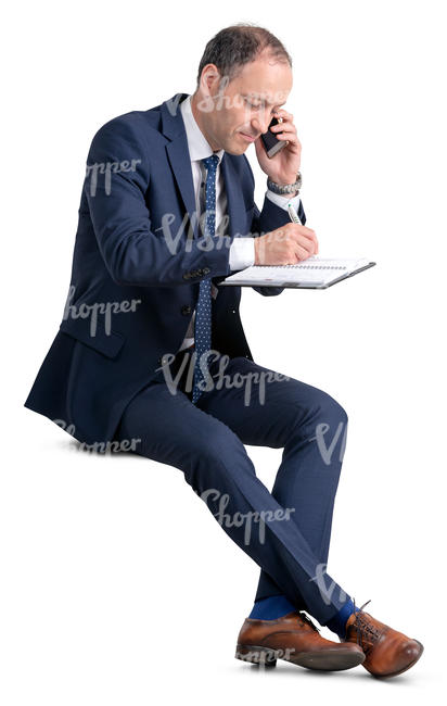 businessman sitting and taking notes