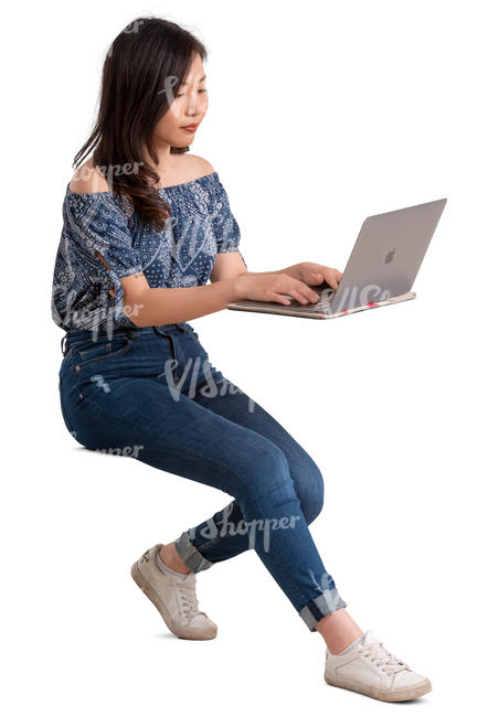 young asian woman sitting behind a desk