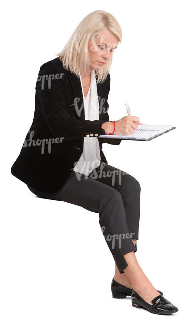 woman writing at the desk