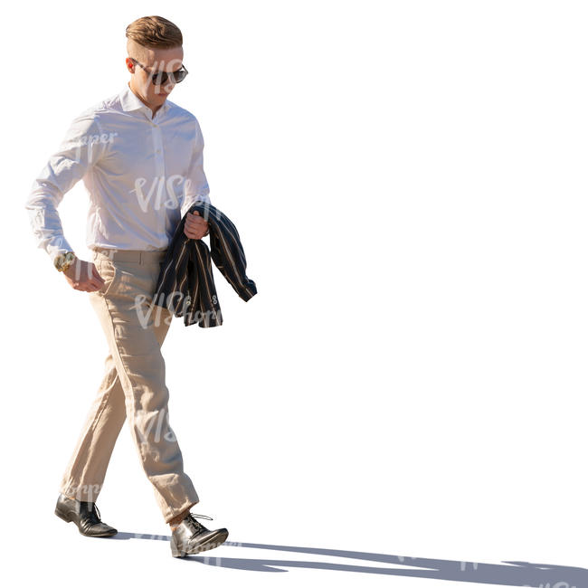 backlit man in a light suit walking