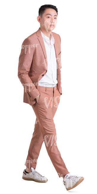 asian man in a pink suit walking