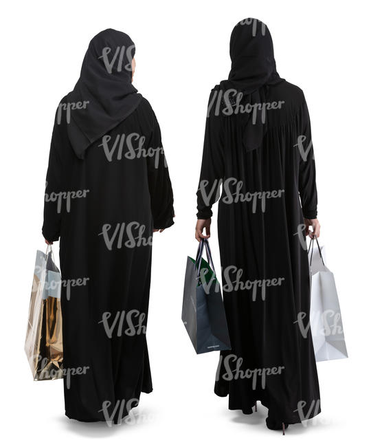 two arab women with shopping bags walking