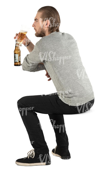 man sitting and drinking beer