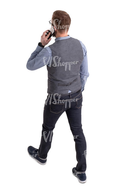 man walking and talking on a phone