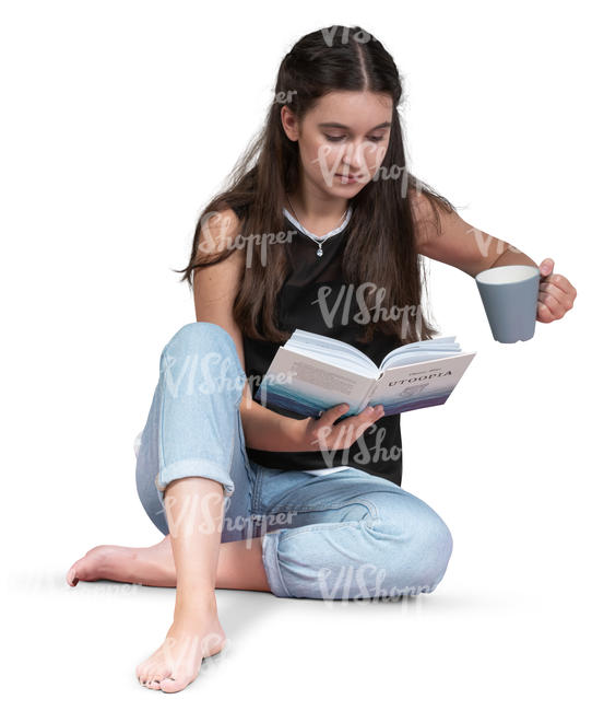 woman sitting on the floor and reading a book