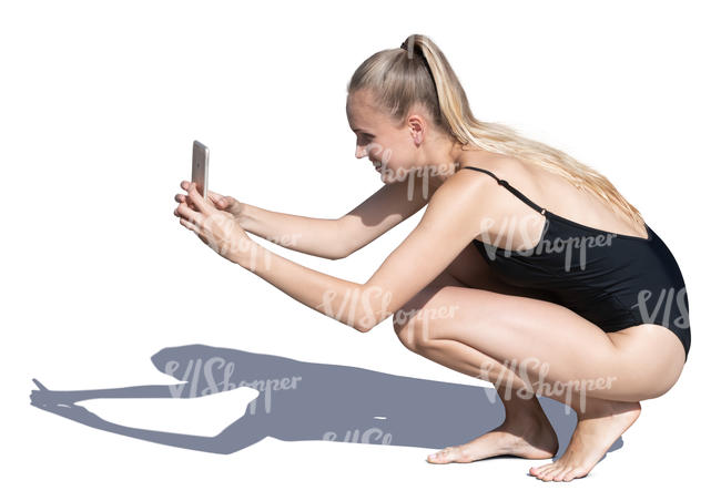 woman in a bathing suit taking a picture