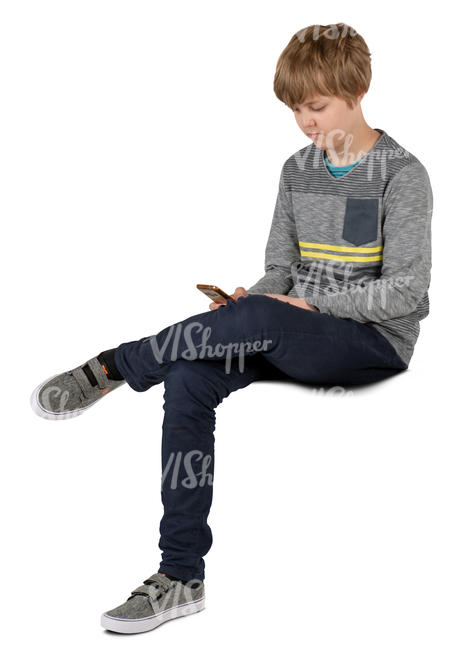 boy sitting and looking at his phone