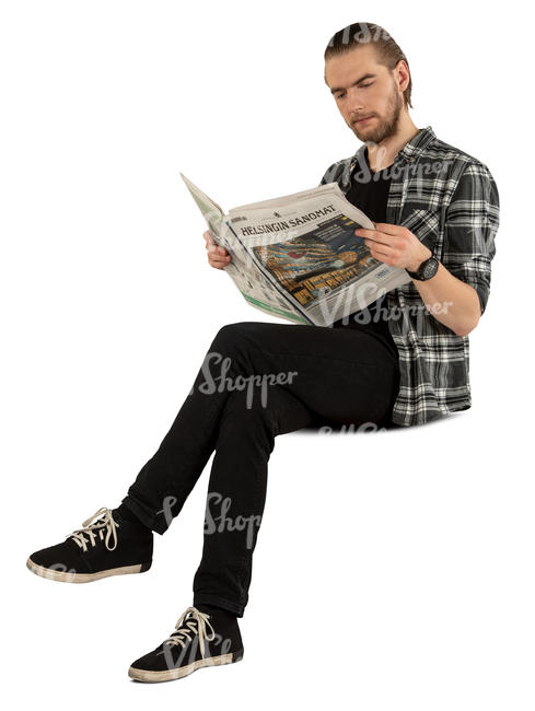 man sitting and reading a newspaper