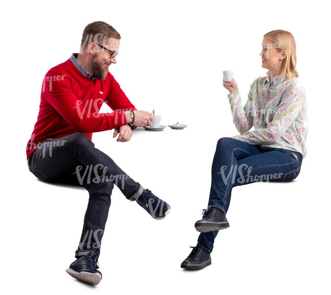 man and woman drinking coffee and talking