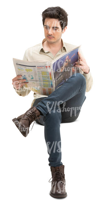 man sitting and reading a newspaper