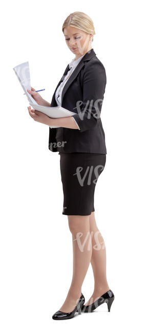 woman in an office standing and looking at papers