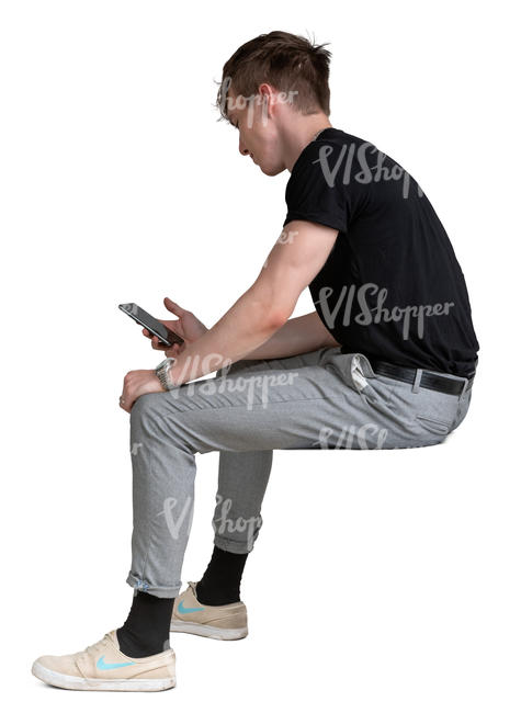 young man with a phone sitting