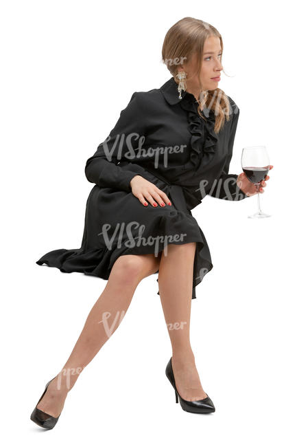 woman in a black dress drinking wine