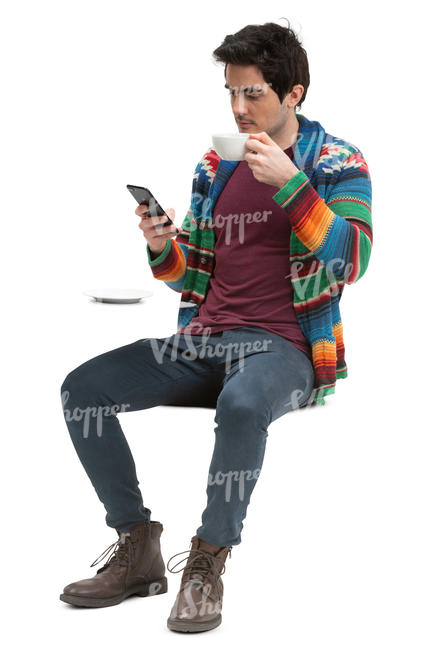 man sitting in a cafe and drinking coffee