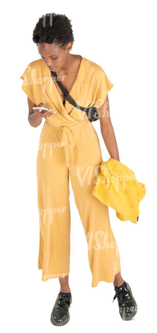 woman in a yellow jumpsuit standing
