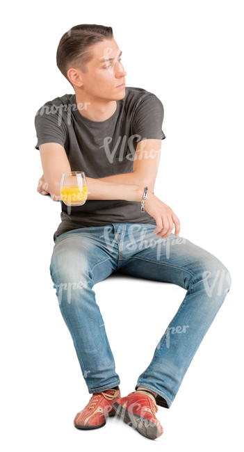 young man sitting at a cafe table