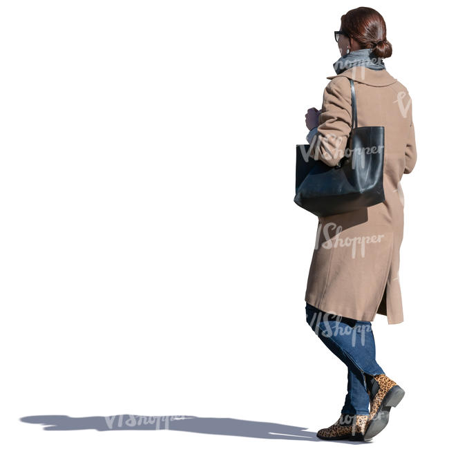 woman in a beige coat walking
