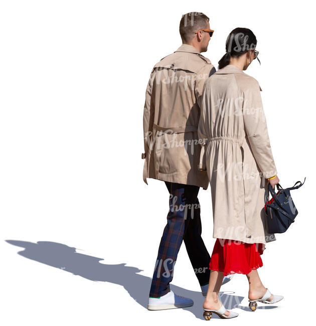 couple in brown overcoats walking
