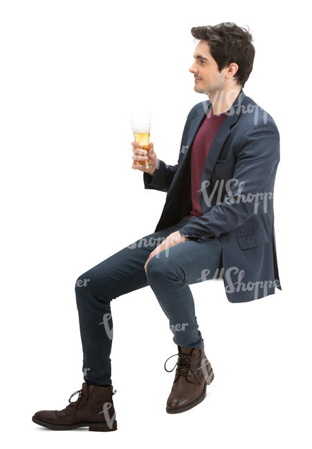 man sitting at a bar and drinking beer