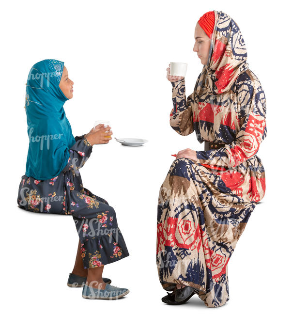 muslim mother and daughter sitting in a cafe and talking