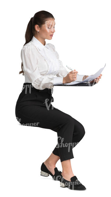 woman at the desk writing notes