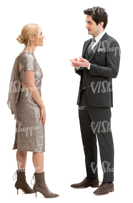 man and woman in party clothes standing and talking