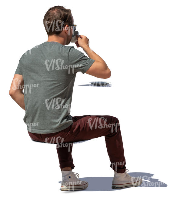 man sitting and drinking coffee on a sunny day