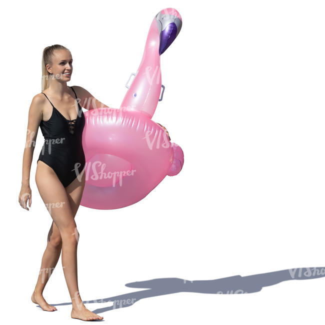 woman walking with a pink floatable flamingo